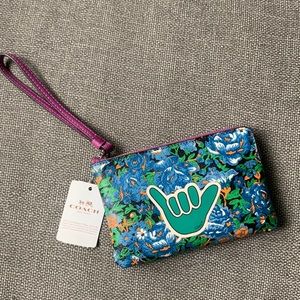 NWT Coach leather wristlet with zip closure.